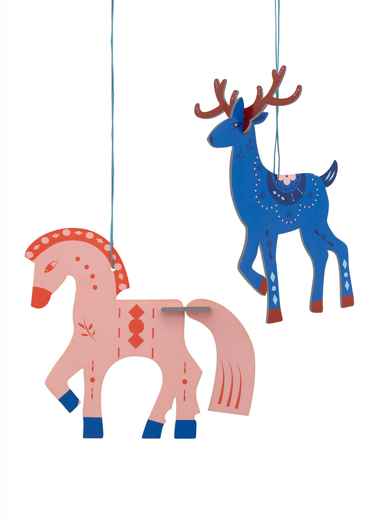 Add a hint of Scandinavian wonder to your holiday décor with The Little Horse & Deer, a colourful pair of recycled cardboard ornaments.